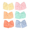 Bow for girl's hair in spring-summer colored fabric with clip.