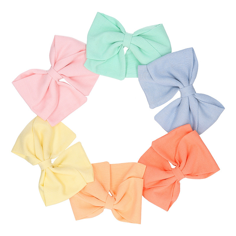 Bow for girl's hair in spring-summer colored fabric with clip