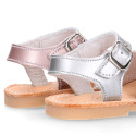 New Menorquina sandals in satin leather with shiny effects.