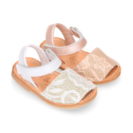 Soft leather Menorquina sandal shoes with pearl effect and laces design.