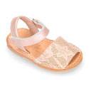 Soft leather Menorquina sandal shoes with pearl effect and laces design.
