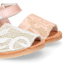 Soft leather Menorquina sandal shoes with pearl effect and laces design.