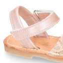 Soft leather Menorquina sandal shoes with pearl effect and laces design.