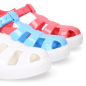 Jelly shoes tennis style design in solid colors.