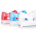 Jelly shoes tennis style design in solid colors.