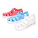 Jelly shoes tennis style design in solid colors.