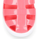 Jelly shoes tennis style design in solid colors.