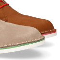 Classic Safari boots in nubuck leather and white soles.