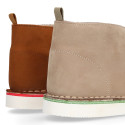 Classic Safari boots in nubuck leather and white soles.