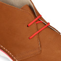 Classic Safari boots in nubuck leather and white soles.