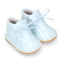 Little bear safari boots in soft colors patent leather.