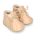 Little bear safari boots in soft colors patent leather.