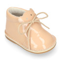 Little bear safari boots in soft colors patent leather.