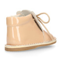 Little bear safari boots in soft colors patent leather.