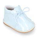 Little bear safari boots in soft colors patent leather.