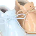 Little bear safari boots in soft colors patent leather.