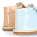 Little bear safari boots in soft colors patent leather.