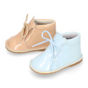 Little bear safari boots in soft colors patent leather.