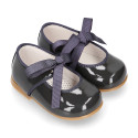 Patent leather little Mary Janes with ties closure.