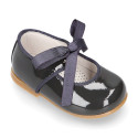 Patent leather little Mary Janes with ties closure.