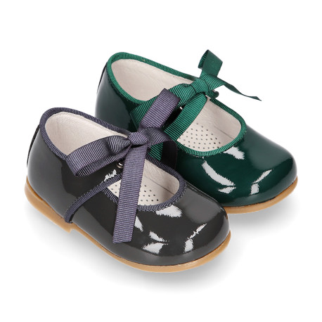 Patent leather little Mary Janes with ties closure.