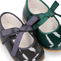 Patent leather little Mary Janes with ties closure.