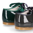 Patent leather little Mary Janes with ties closure.