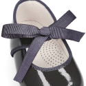 Patent leather little Mary Janes with ties closure.