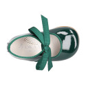 Patent leather little Mary Janes with ties closure.