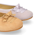 New suede leather Ballet flats with crossed ribbons.