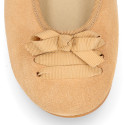 New suede leather Ballet flats with crossed ribbons.