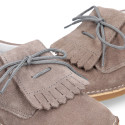 Little Classic Oxford style shoes with fringed design and flexible soles in suede leather.