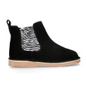 Suede leather ankle boots with animal print elastic band.