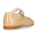 Classic patent leather little Mary Jane shoes with flower detail.