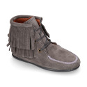 MOHICAN style Medium height ankle boots with fringed design in suede leather.