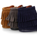 MOHICAN style Medium height ankle boots with fringed design in suede leather.
