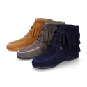 MOHICAN style Medium height ankle boots with fringed design in suede leather.