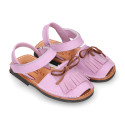 Nubuck leather Menorquina sandal shoes with hook and loop strap and fringed design.