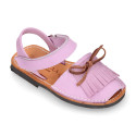 Nubuck leather Menorquina sandal shoes with hook and loop strap and fringed design.