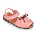 Nubuck leather Menorquina sandal shoes with hook and loop strap and fringed design.