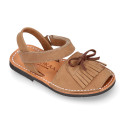 Nubuck leather Menorquina sandal shoes with hook and loop strap and fringed design.