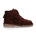 Suede leather ankle boots with fringed and central stitches design.