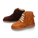 Suede leather ankle boots with fringed and central stitches design.