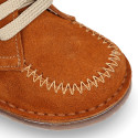 Suede leather ankle boots with fringed and central stitches design.