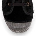 Velvet kids sneakers with laces and rubber toe cap.