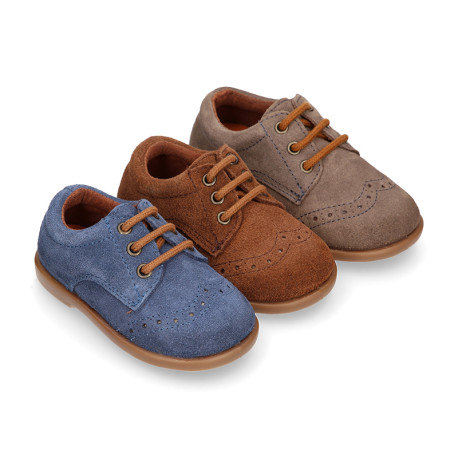 Classic suede leather Laces up shoes with perforated design for autumn.