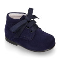 Suede leather little classic ankle boots with ties closure.