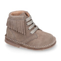 Suede leather ankle desert boots style with fringed design.