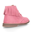 Suede leather ankle desert boots style with fringed design.