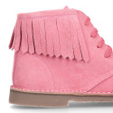 Suede leather ankle desert boots style with fringed design.